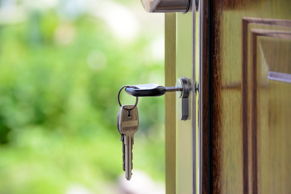 An image of a landlord holding legal documents and keys, standing outside a rental property
