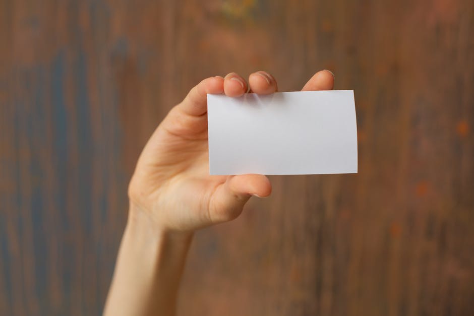 Image of a person holding a pen and paper, representing the process of documenting and giving a move-out notice in Maryland.