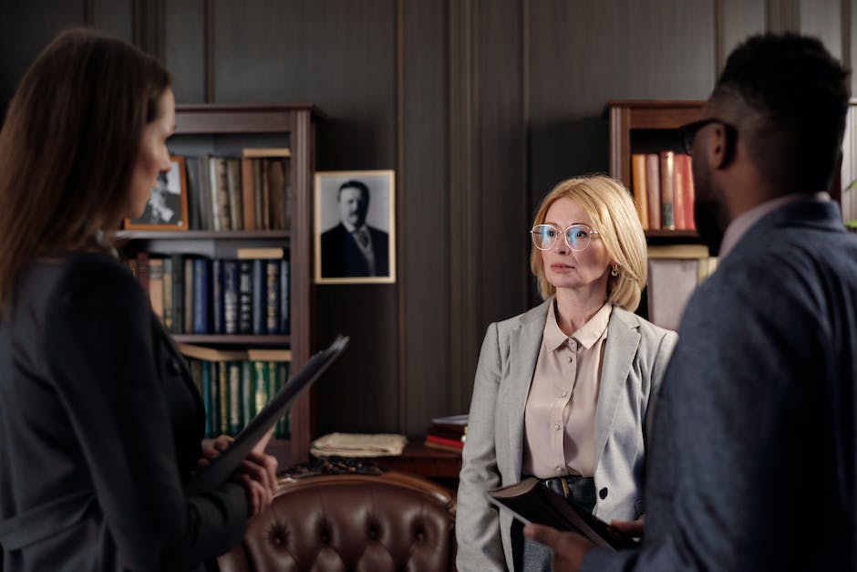 A courtroom scene with lawyers, judges, and tenants discussing legal matters