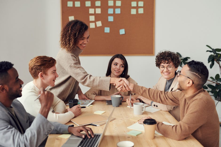 A realistic image showing a tenant and a landlord discussing payment plans for owed rent in an office setting