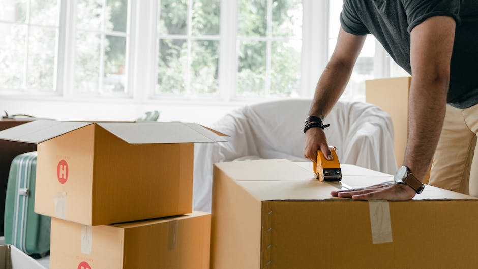 Image depicting a property manager discussing fees with a homeowner at a desk.