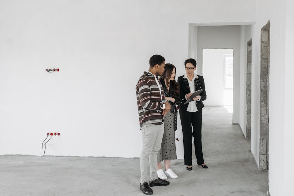An image depicting a landlord and a tenant discussing financial documents in an office setting