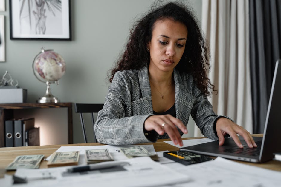 A professional property manager reviewing documents in an office setting