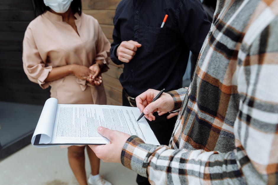 Image showing a person signing a contract termination document.