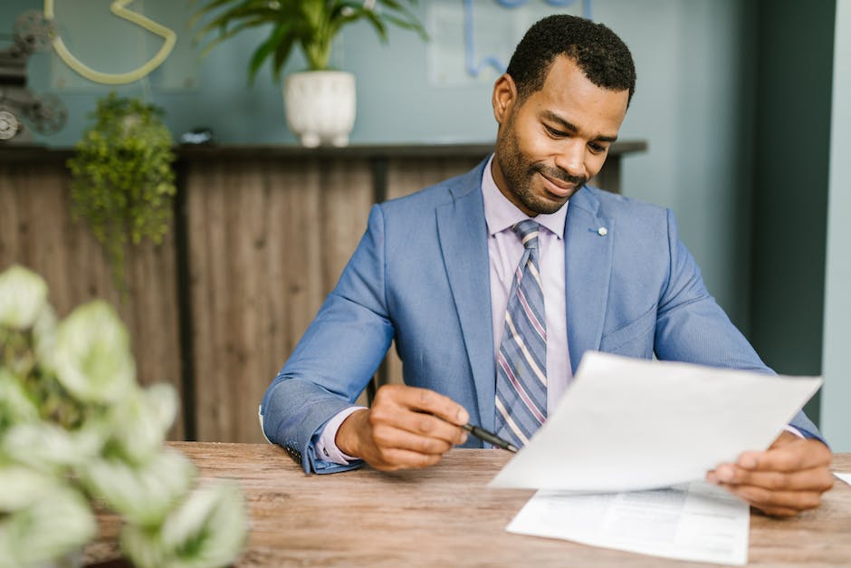 Image depicting a person reading property management documents