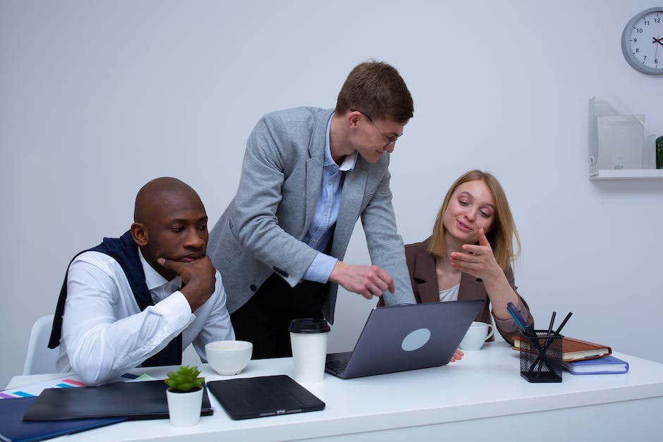 An image depicting a property manager discussing property management regulations with a client in Maryland.