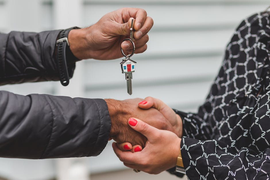Illustration of a person holding a key, representing the concept of property management