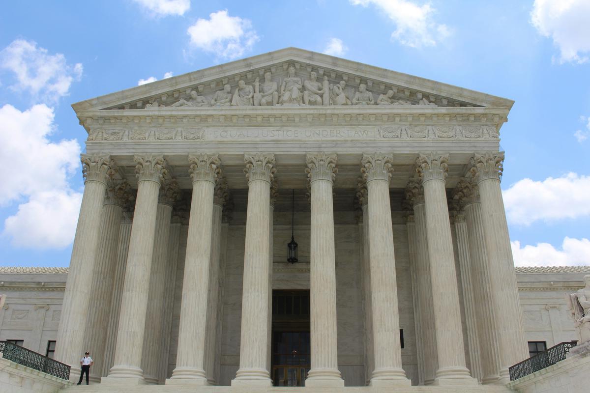 A realistic image depicting a legal office setting with documents, a gavel, and a scale symbolizing the balance between landlord rights and tenant protections