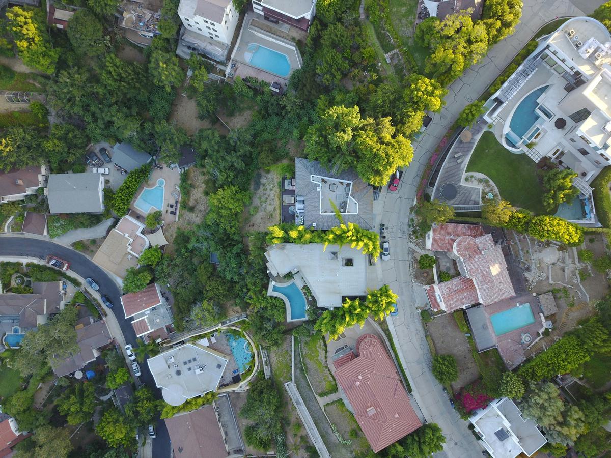 An image of a diverse neighborhood in Prince George's County, Maryland with various types of residential buildings and people interacting. The neighborhood showcases a mix of urban and suburban areas.