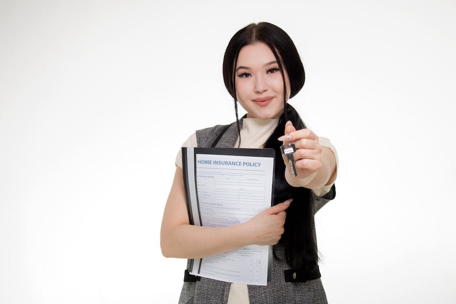 An image showing a hand holding a renters insurance policy, symbolizing the benefits of having renters insurance for landlords and tenants.