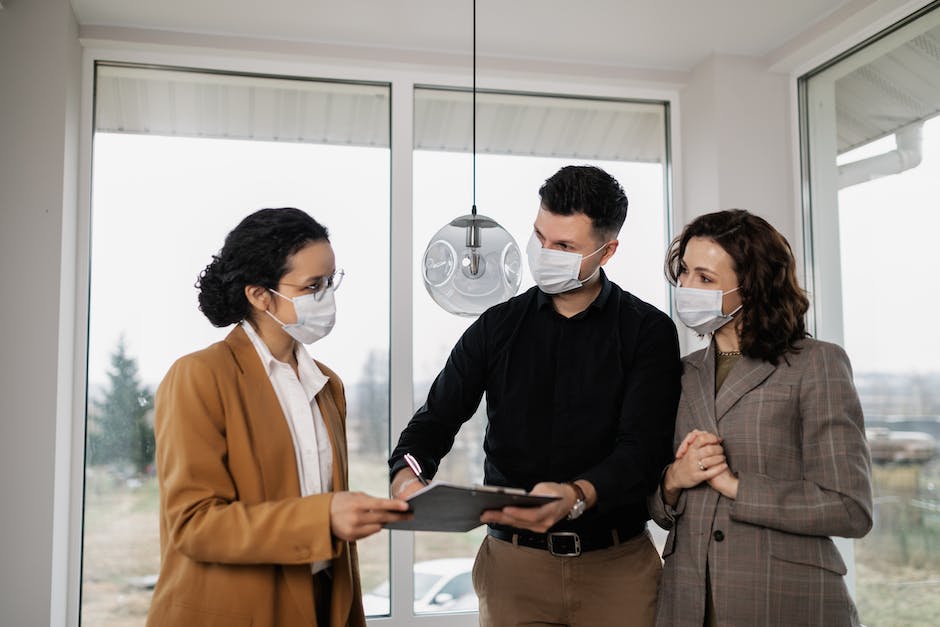 Image depicting a landlord and tenant signing a lease agreement.