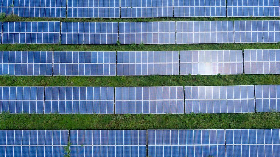 Image illustrating the solar panel cost dilemma, showing a rooftop with solar panels and a person pondering the decision.