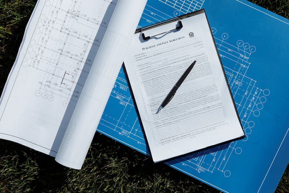 Image of a contract document with pen and glasses